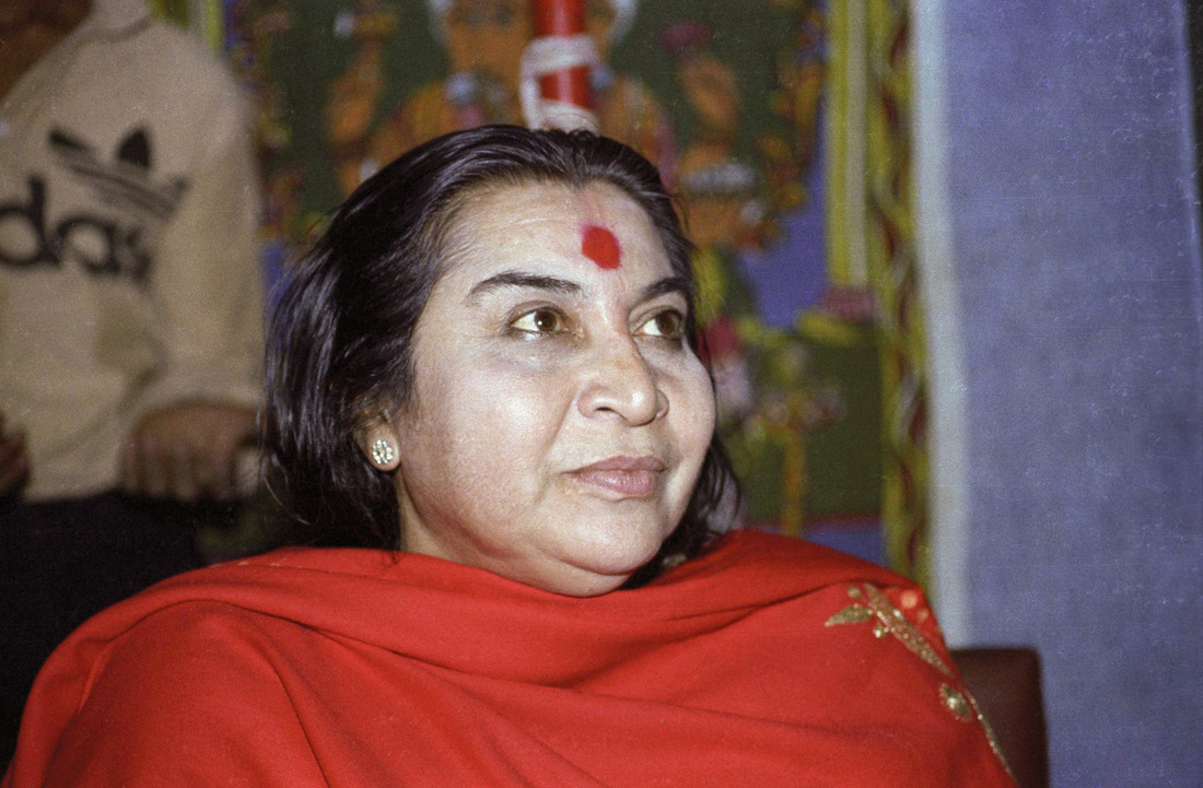 Shri Mataji Nirmala Devi, head and shoulders, with red shawl